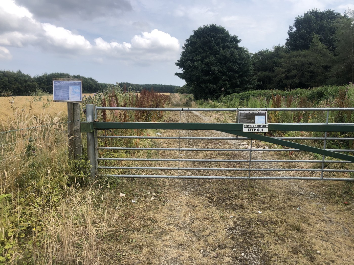 A trail barred with two gates and signs saying to keep out. They really don’t want you in there!